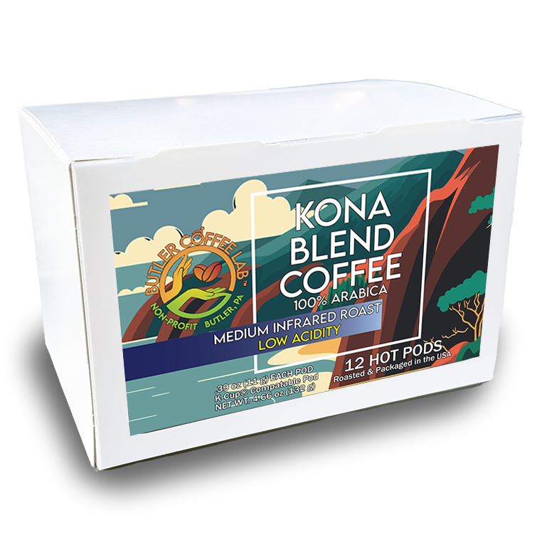 A box of Kona Blend Coffee with a graphic design featuring clouds, a coffee bean, and a cityscape. The box indicates it contains 12 hot pods.